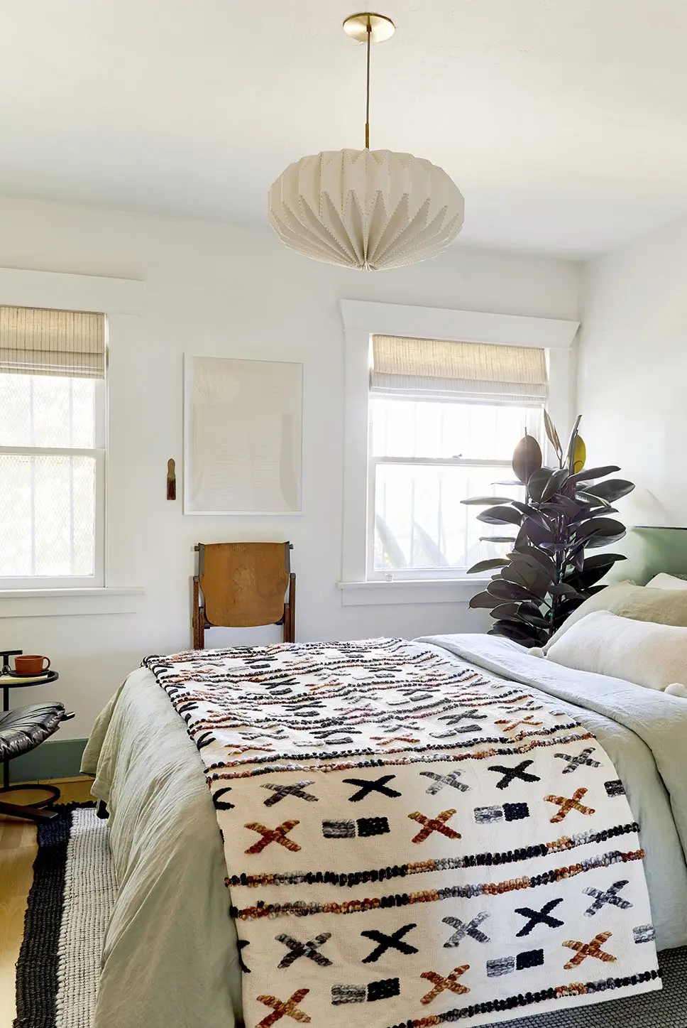 white bedroom with green bedding