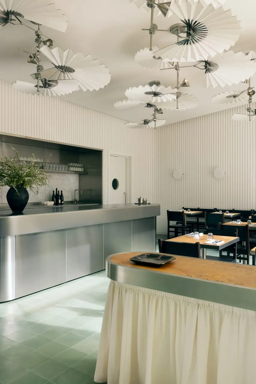 White sculptural lamps in London restaurant