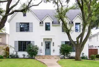 Neutral home exterior with gray shutters