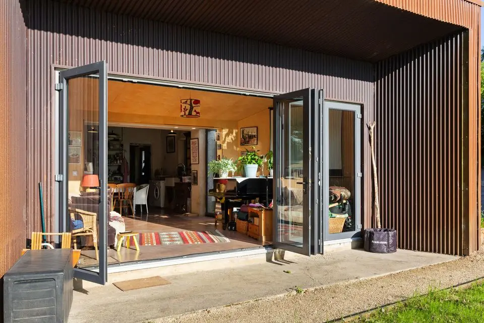 The bi-folding glazed doors to the patio and garden