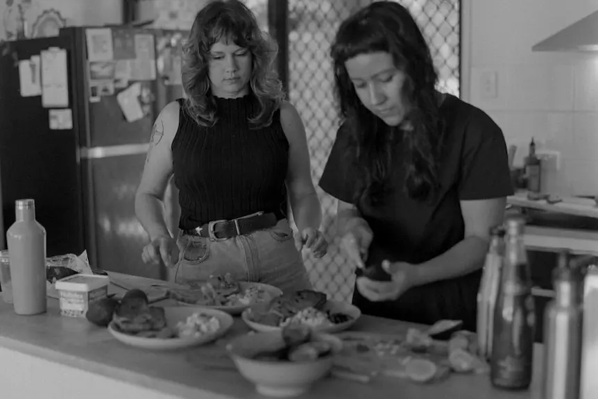 Two women preparing a meal