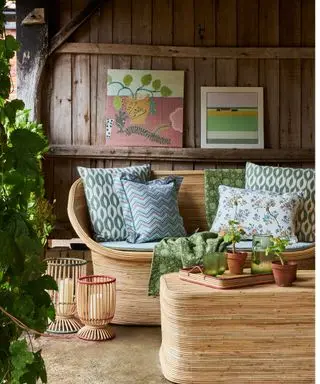 rattan seating with coffee table and patterned cushions