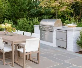 Planted borders created as outdoor kitchen decor