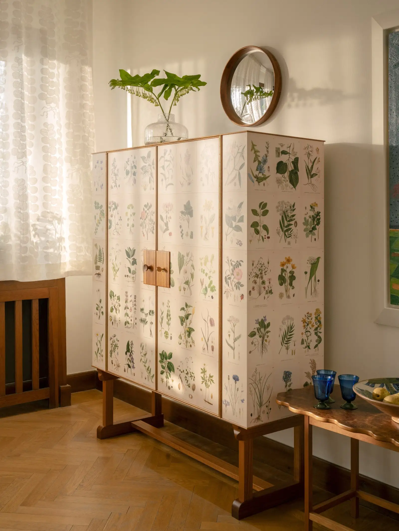 Meticulously crafted from mahogany and birch the Flora Cabinet draws upon illustrative botany and classic crafting...