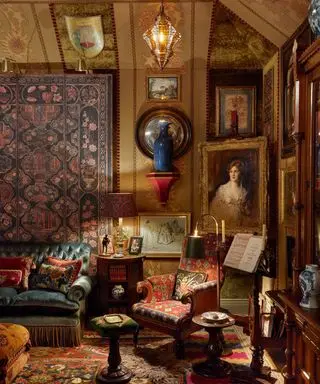 living room full of stuff in gothic style and dark colours