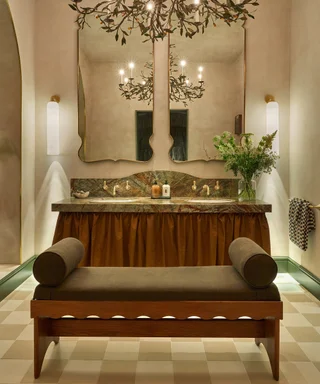 bathroom with double vanity with skirt and bench