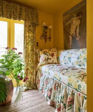 yellow color drenched bedroom with floral upholstered day bed