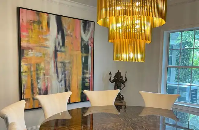 GO BIG: In small spaces, large art, such as this painting by artist Mark Pulliam, can create the illusion of a bigger space while giving the room personality.