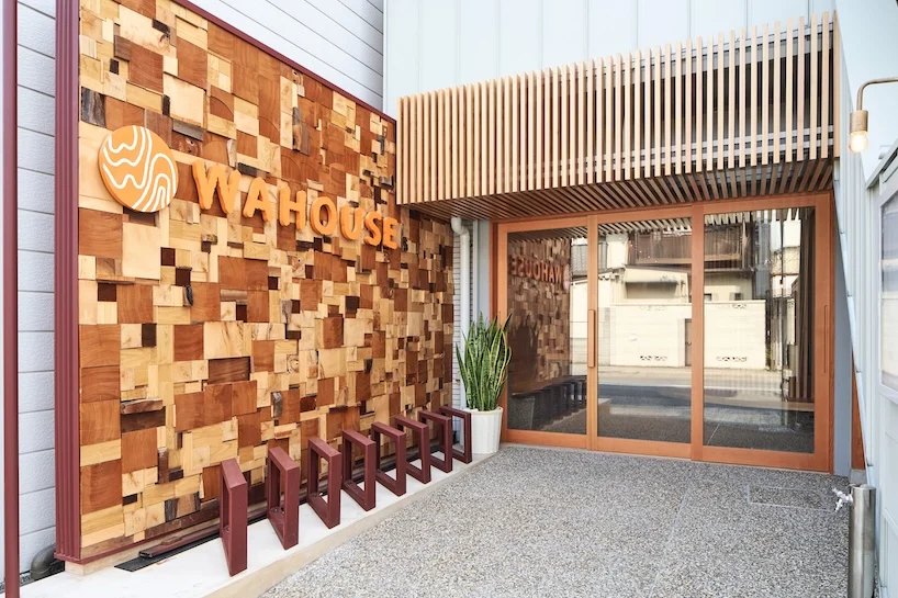 wooden louvers run along kyoto office space's entire interior by ujizono architects