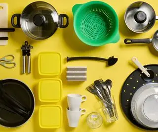 An assortment of college dorm essentials against a bright yellow background