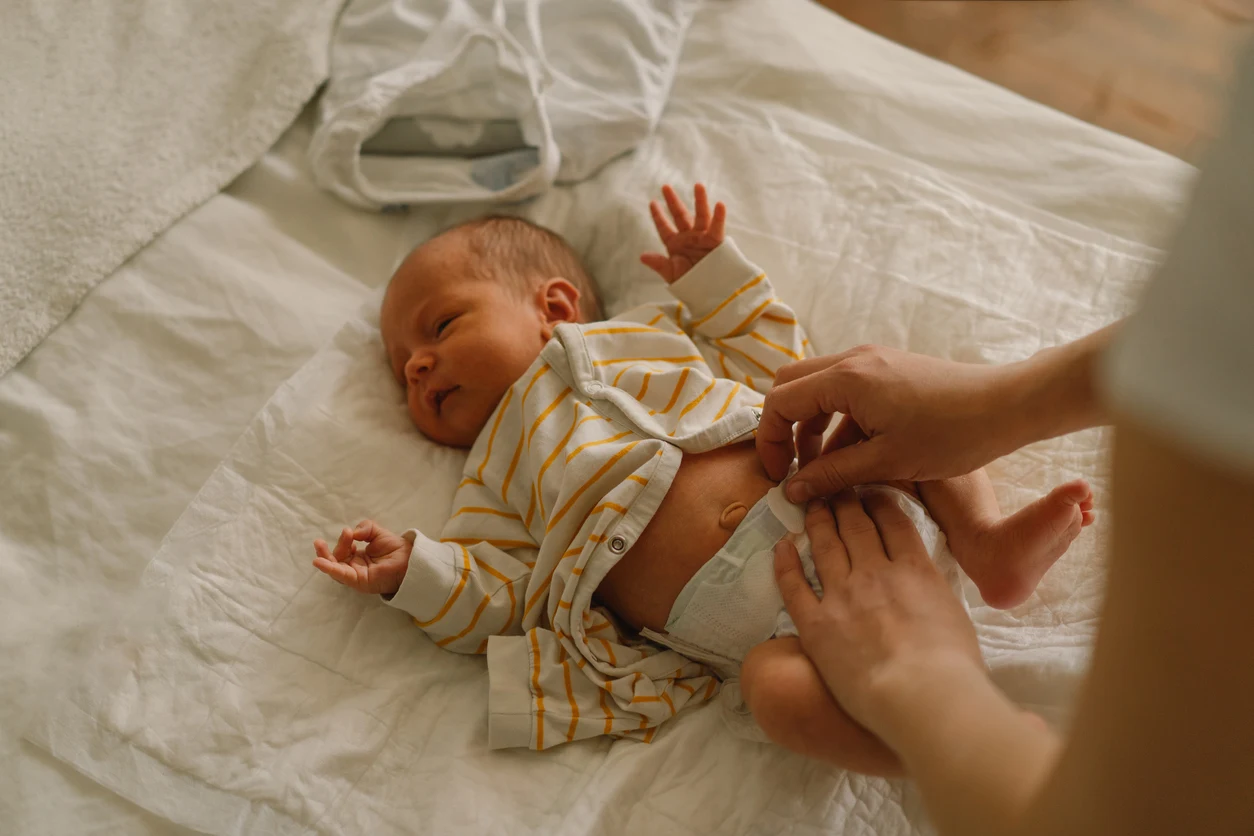 Parent changing diaper