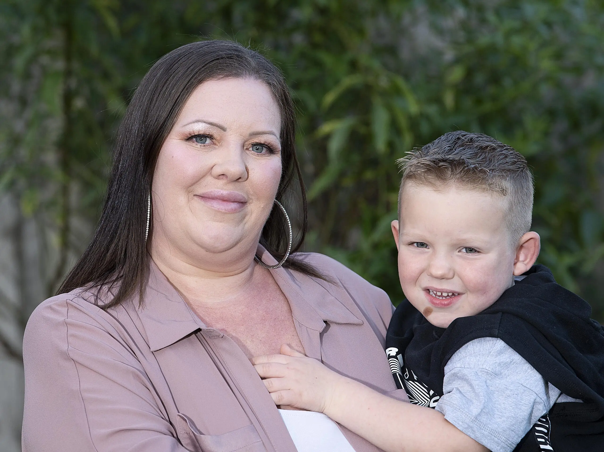 Chelle Brown with her son River, who loves doing household chores for cash