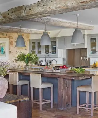 Kitchen island with dining stools in french cottage