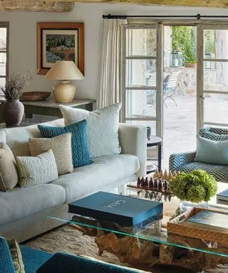 dining area with light blue sofa in french cottage