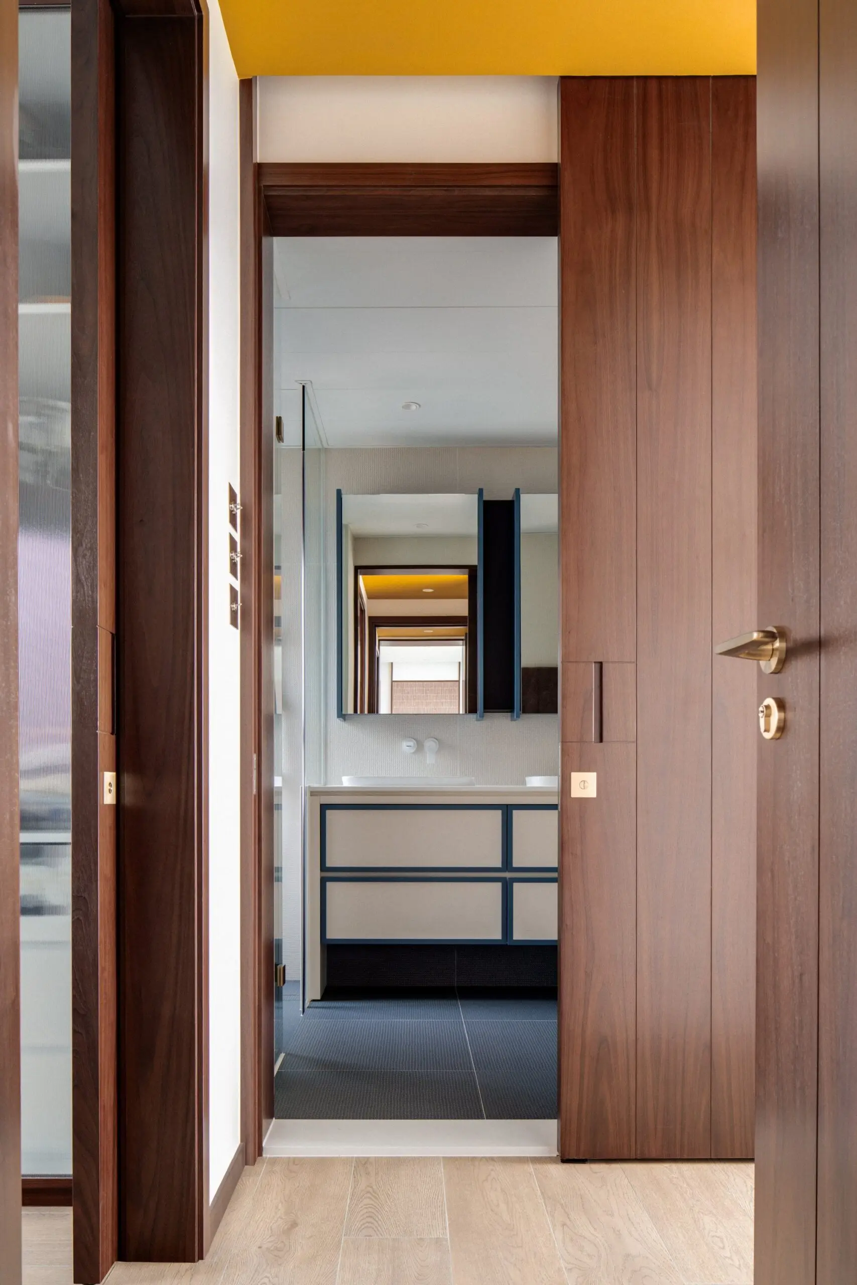 The saffron ceiling in a corridor adds a pop of colour. Photo: Harold de Puymorin image