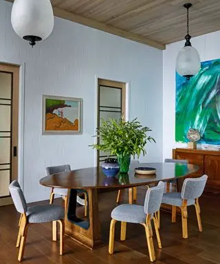 dining room with oval wooden table and upholstered chairs