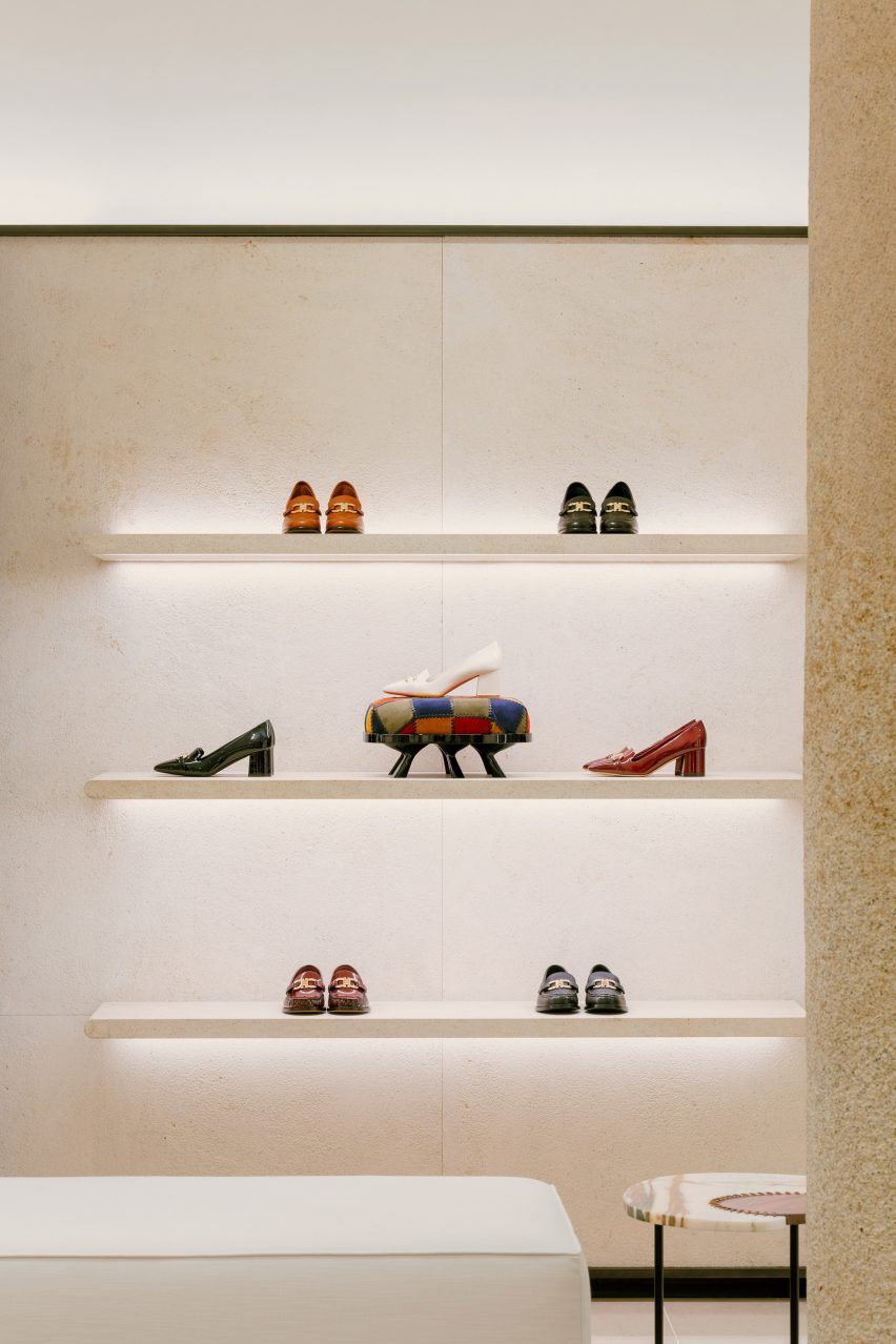 Display shelves holding shoes inside Ferragamo store