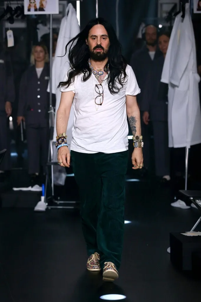 Fashion designer Alessandro Michele with long hair, wearing a white shirt and black pants, at the Gucci runway during Milan Fashion Week Fall/Winter 2020-2021