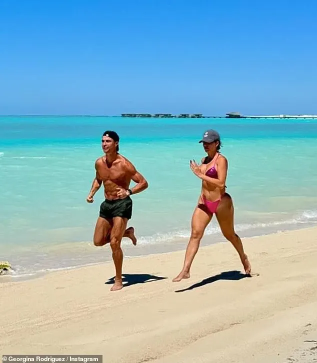 Her and the football icon were snapped during a gruelling beach run by the shoreline as they both showed off their incredibly toned figures