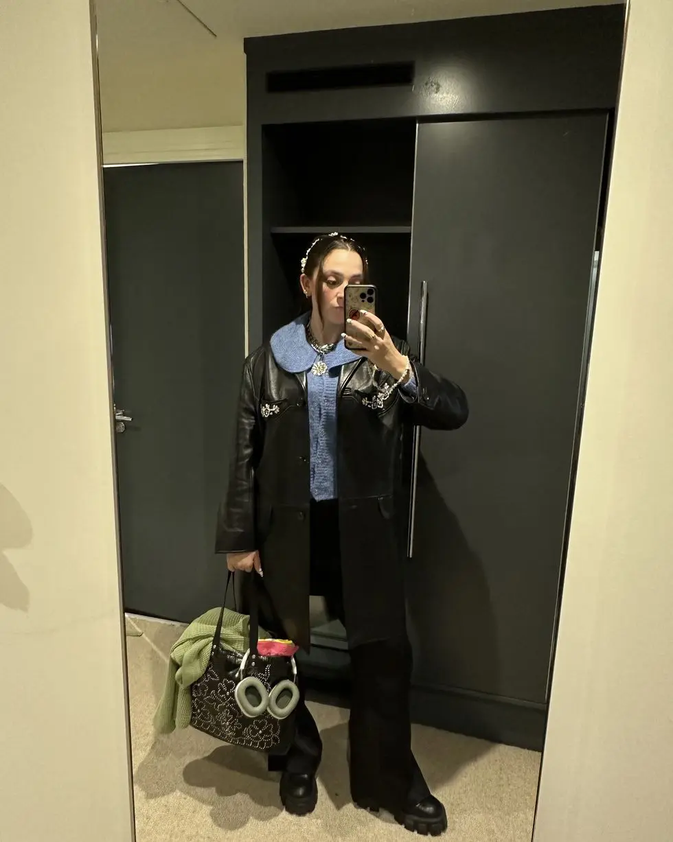 a person taking a selfie in a mirror