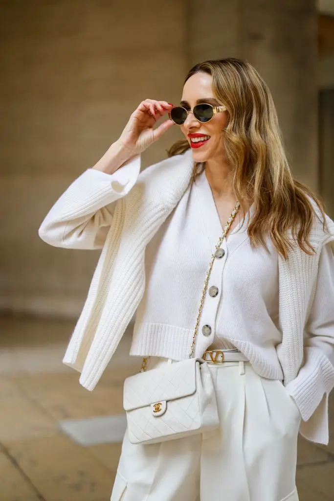 Alexandra Lapp wears Celine Triomphe sunglasses in gold in March 2024