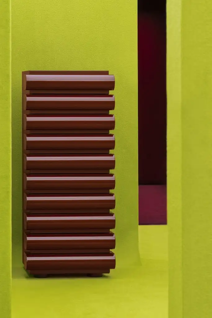 an oxblood designer modern 10-drawer dresser is in an acid green maze