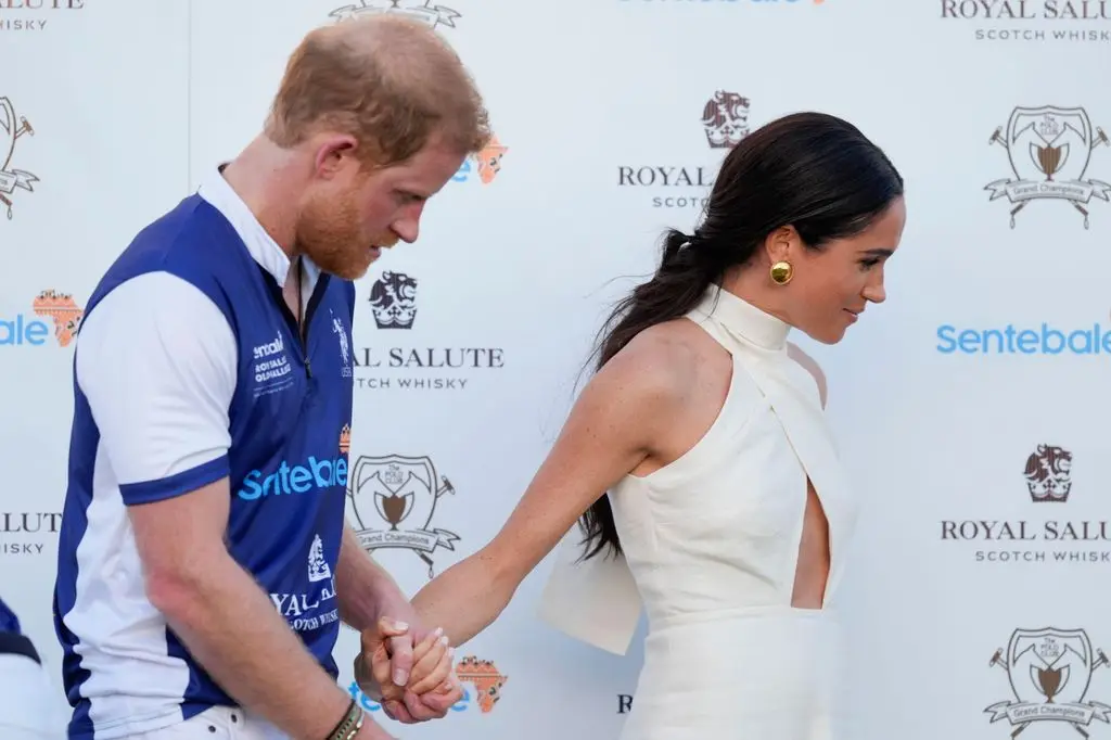 Meghan looked gorgeous in a summery dress and vintage Chanel earrings