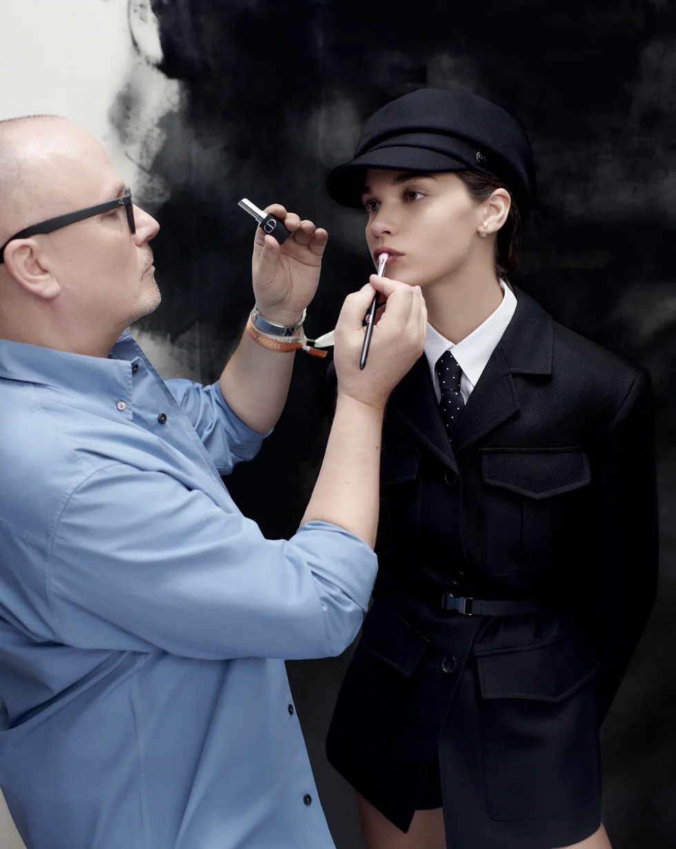 a man smoking a cigarette next to a woman