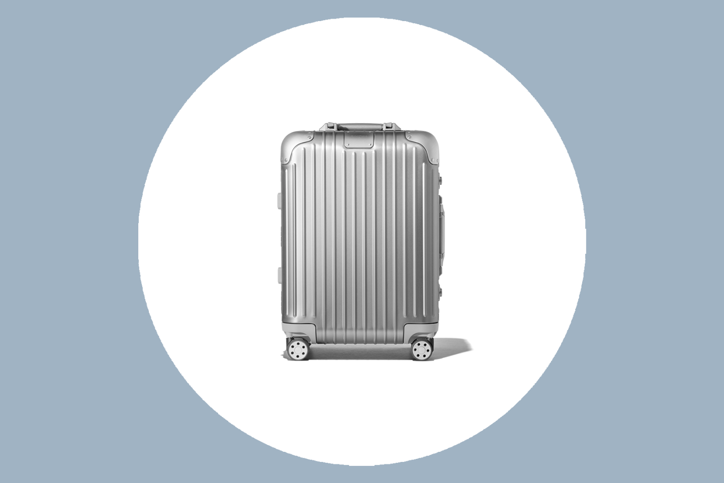 Rimowa Original Cabin Carry On in Silver in a white circle on gray background