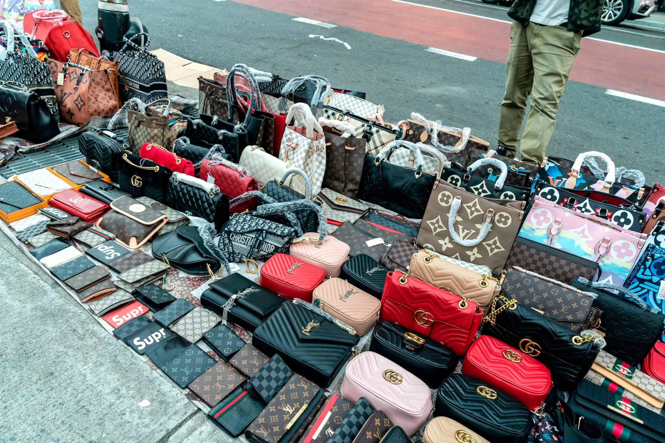 PHOTO: In this Nov. 19, 2020, file photo, street vendors sell counterfeits goods like bags, sunglasses, belts and watches, in New York.