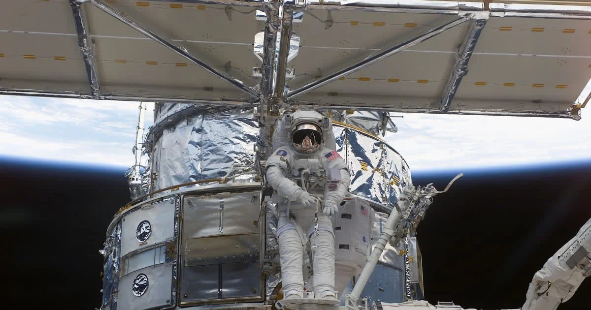 In this NASA image, astronaut Richard M. Linnehan replaces the starboard solar array on the Hubble Space Telescope during a spacewalk on March 4, 2002.(Photo by NASA/Getty Images)