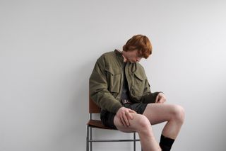 Utilitarian and Workwear-inspired S/S 2024 Men’s Fashion photographed against white wall