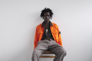 Utilitarian and Workwear-inspired S/S 2024 Men’s Fashion photographed against white wall