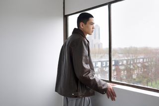 Utilitarian and Workwear-inspired S/S 2024 Men’s Fashion photographed against white wall