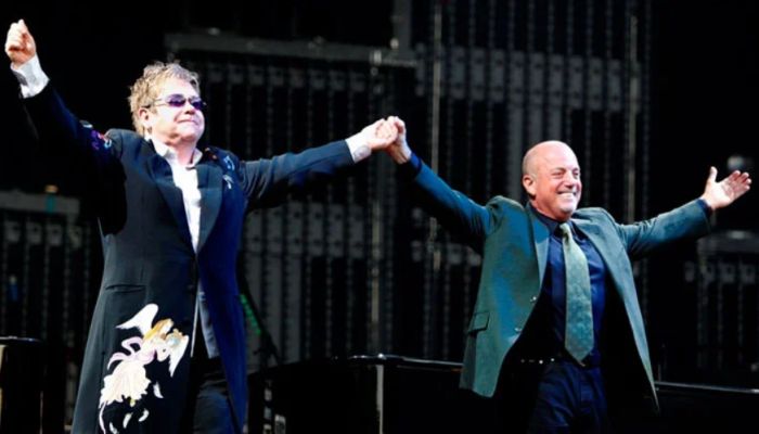 Billy Joel Is Teased on a Poster for Elton John’s Glastonbury Performance