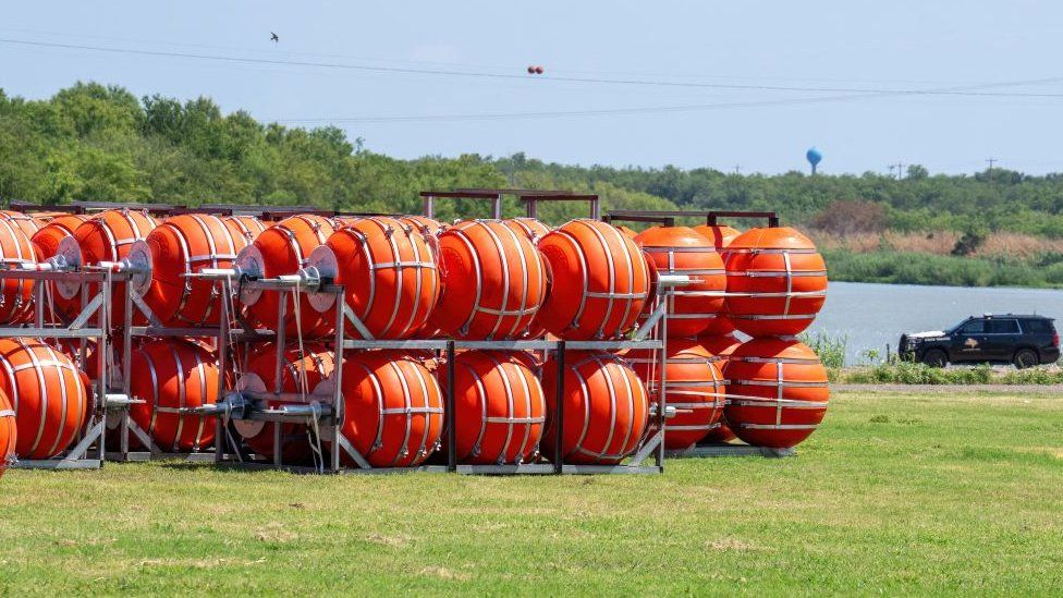 Justice department sues Texas over floating barrier