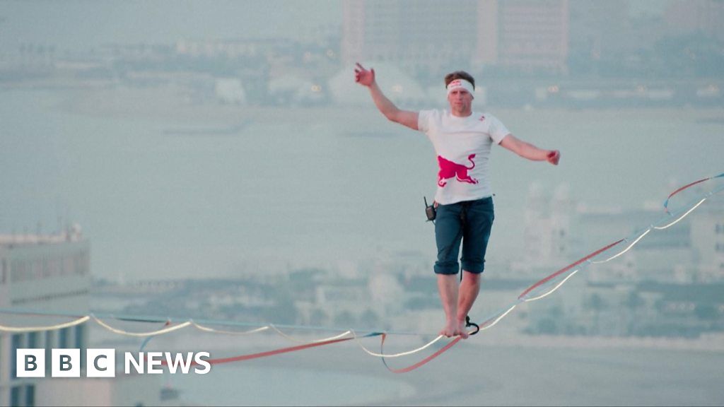 Watch: Man walks Qatar slackline 185m above ground