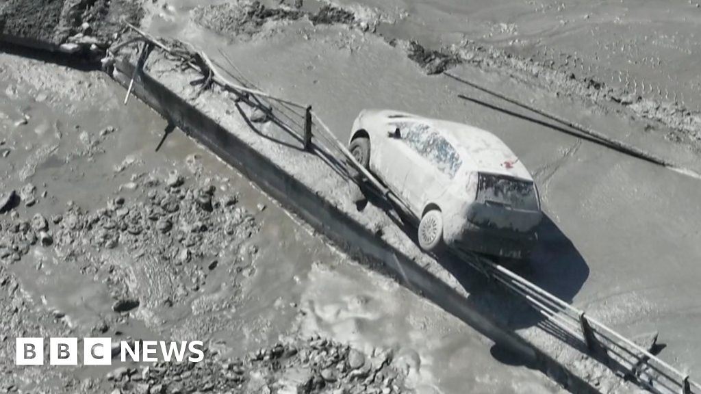 Muddy floodwater rips through Italian town’s riverbank