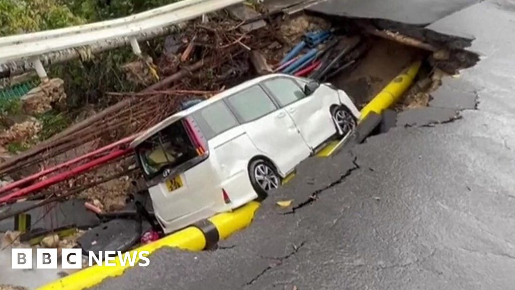 Watch: Cars in craters as streets flood in Hong Kong