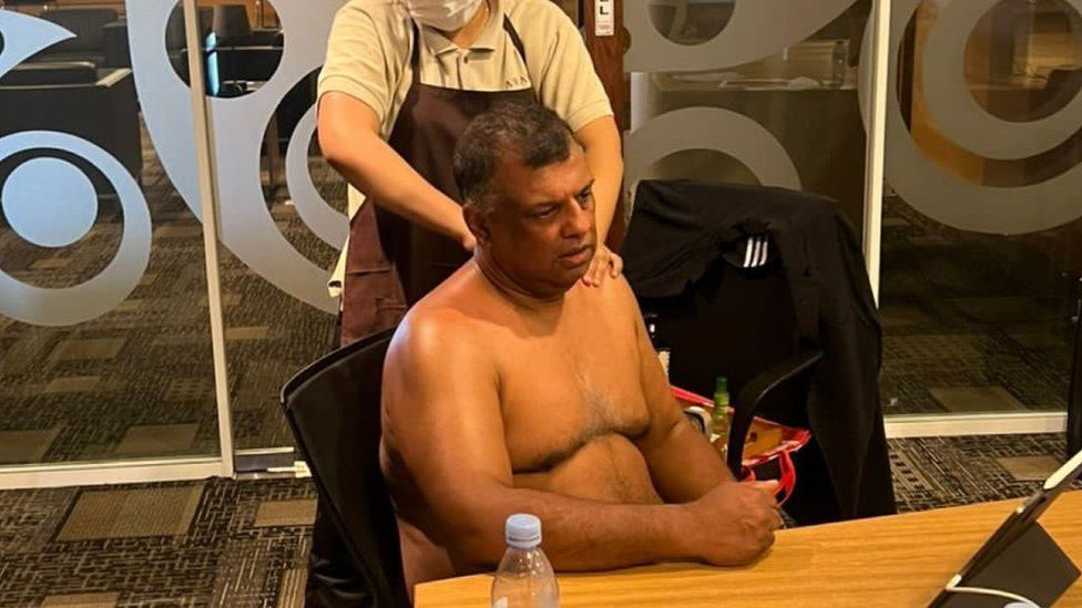 AirAsia boss Tony Fernandes criticised for half-naked massage photo