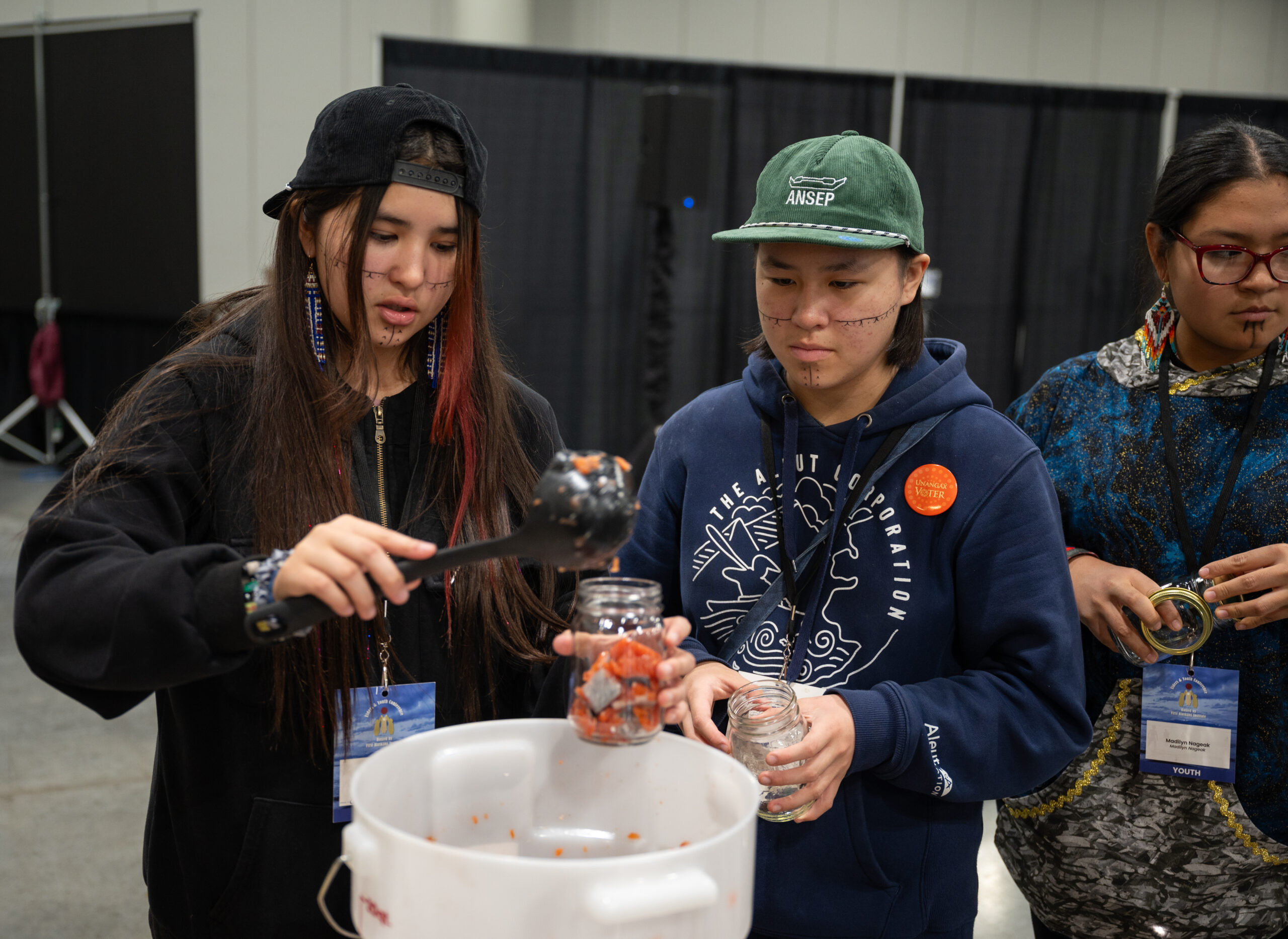 Alaska Native youth preserve traditions by preserving traditional food at Elders and Youth Conference