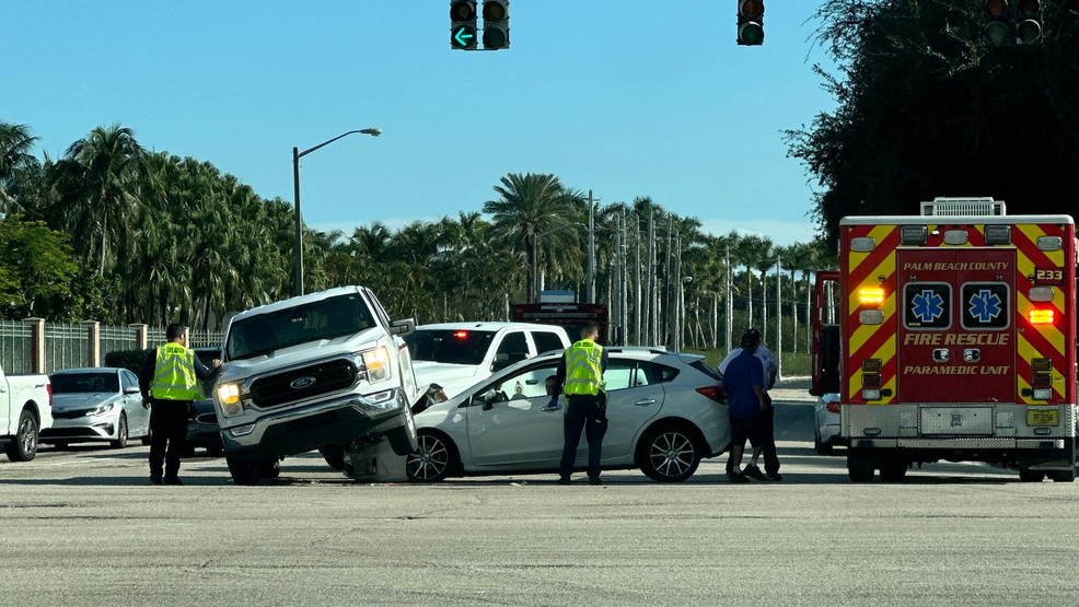 Unusual crash in West Palm Beach leaves truck on top of car near Tanger Outlets