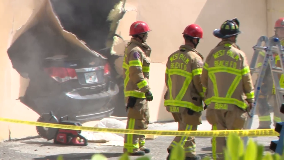 PHOTOS: Car crashes through building on Australian Avenue, no injuries reported