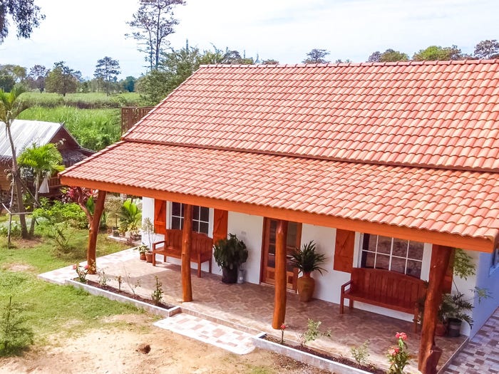 They built a small house in rural Thailand for $22,500. They don’t have debt, but that doesn’t mean the lifestyle is easy.