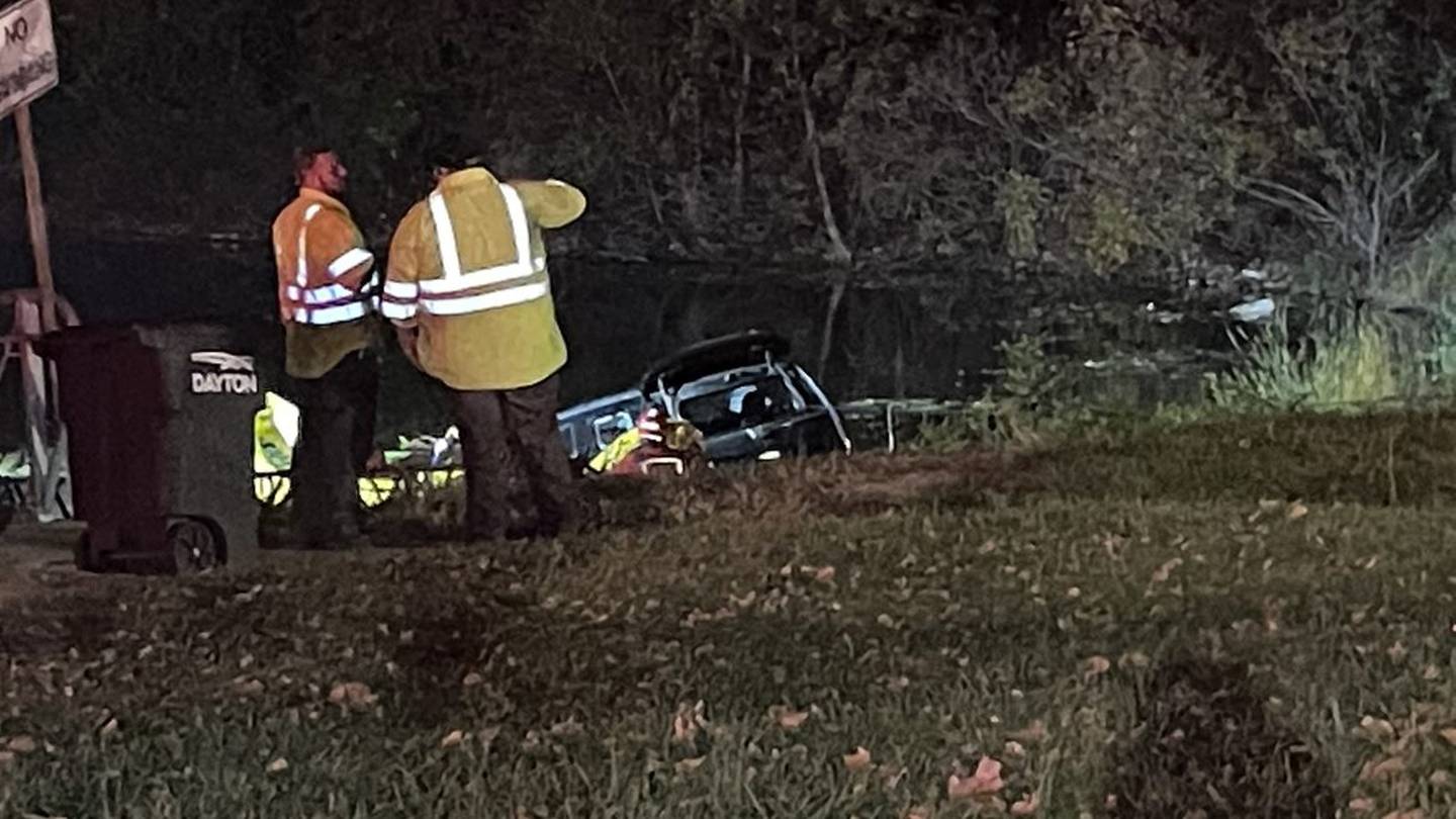 Rescue boats on scene after vehicle goes into water in Dayton