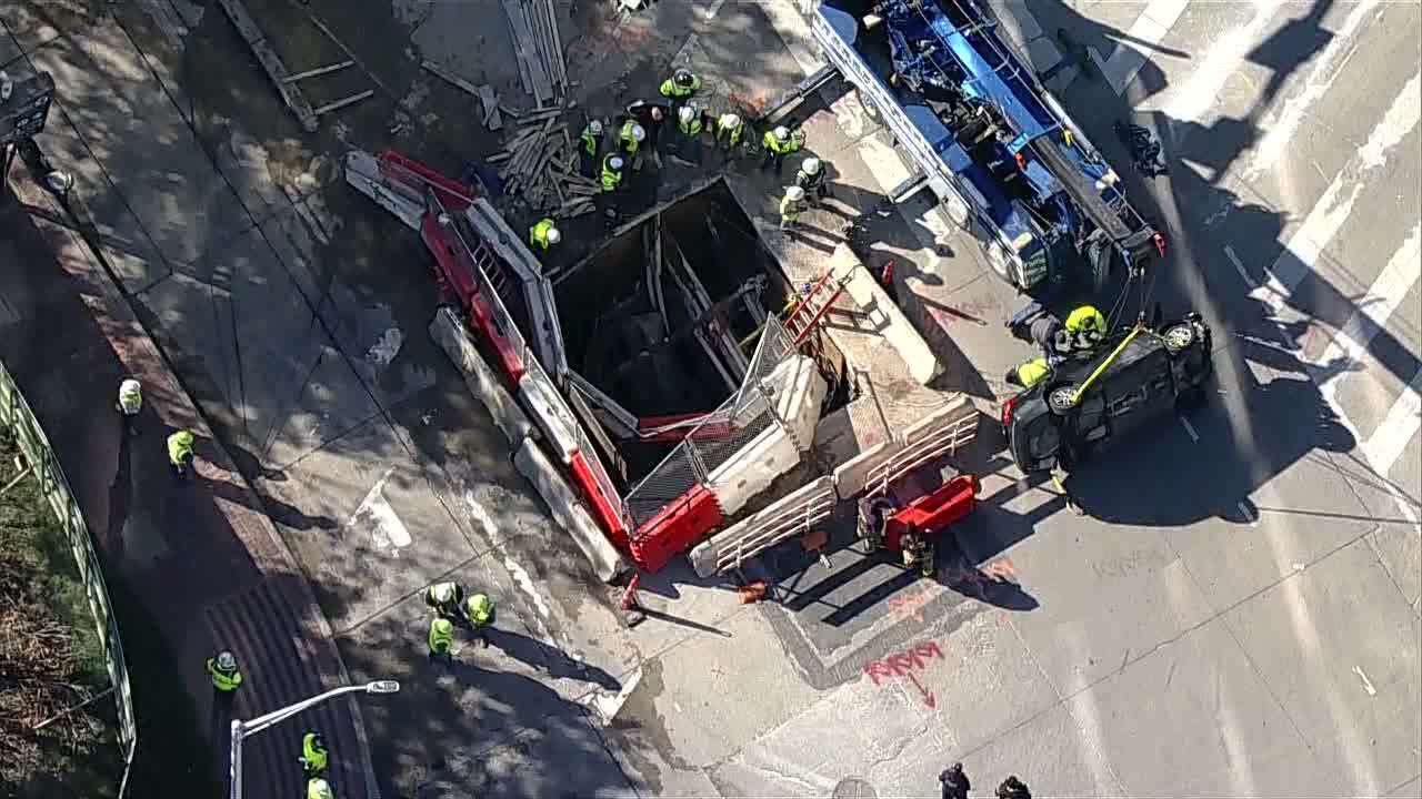 Dallas workers hurt when car crashes into construction hole