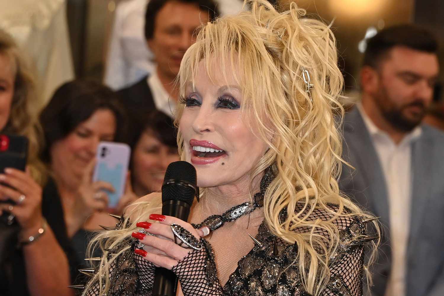 Dolly Parton Celebrates Ribbon Cutting of Fashion Exhibit in Nashville: ‘That’s a Lot of Living’