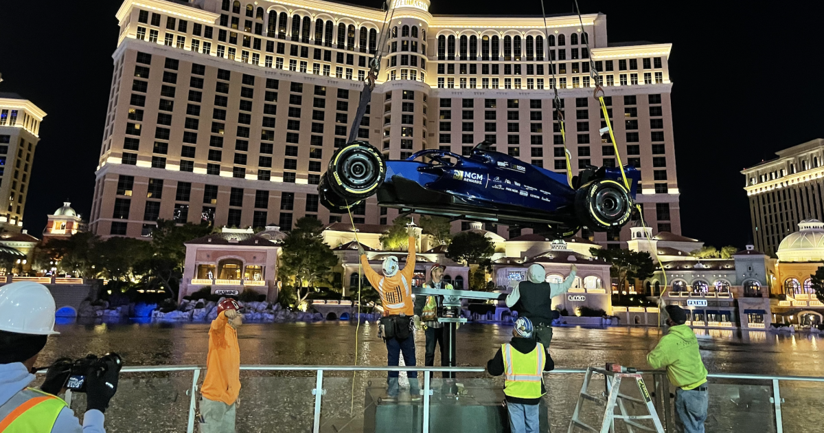 Crews install MGM Rewards’ F1 show car at the Bellagio Fountains ahead of Las Vegas Grand Prix