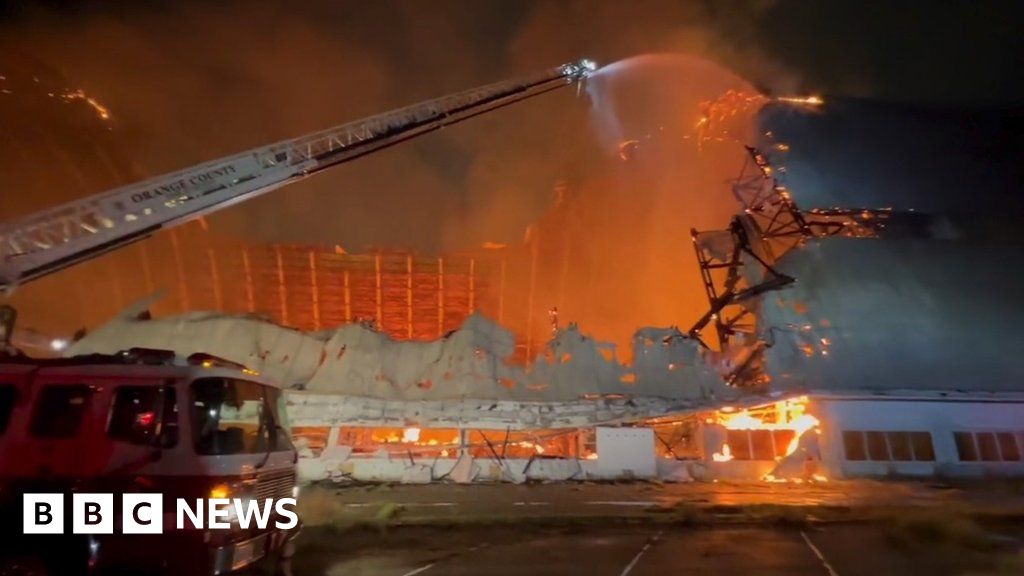 WW2-era blimp hangar engulfed in flames