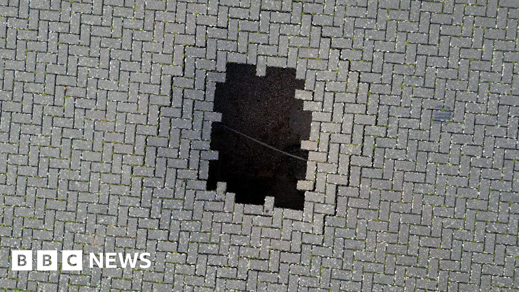 Watch: Sinkhole appears in car park near school